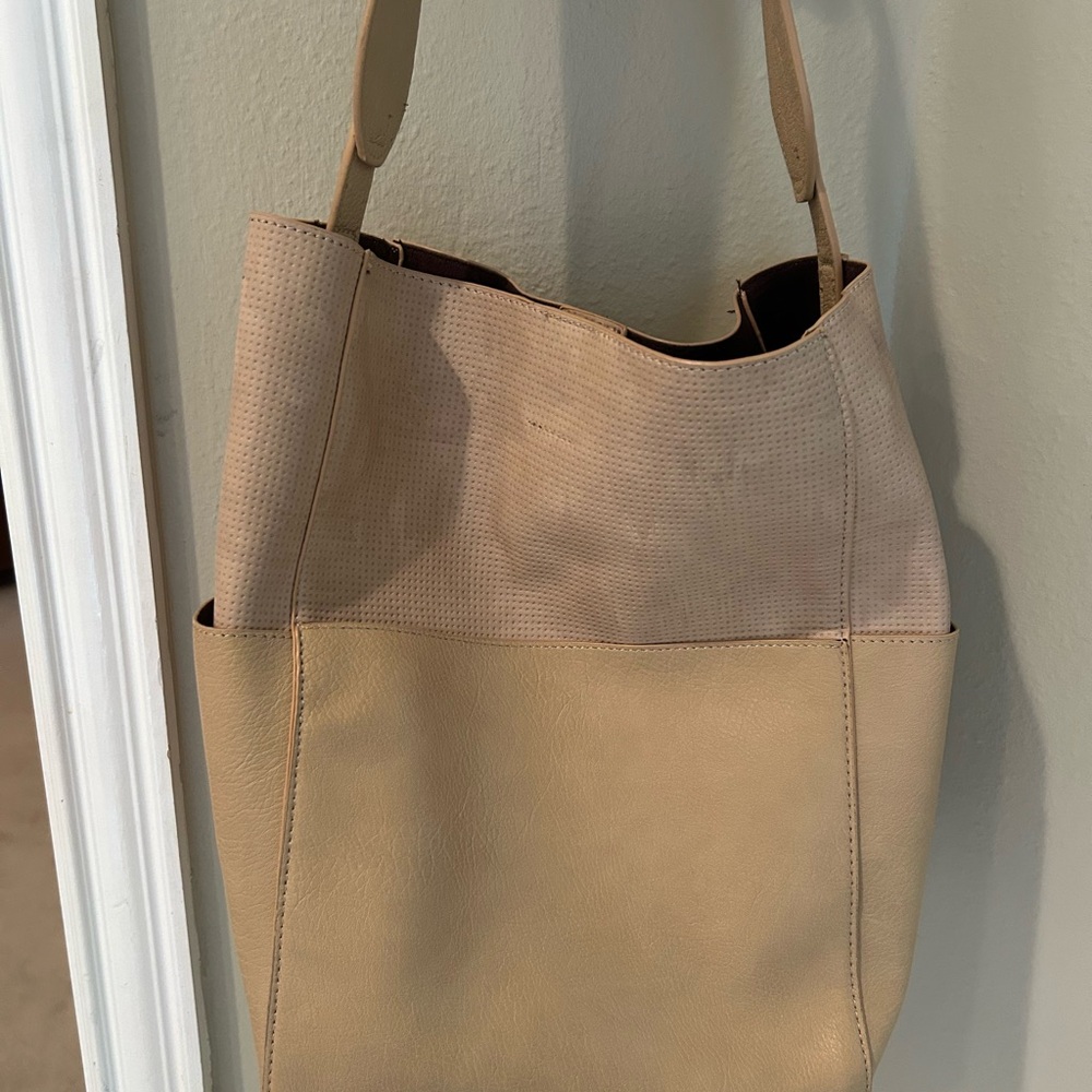 Great bag from Anthropologie includes nice zipper pouch for organizing.